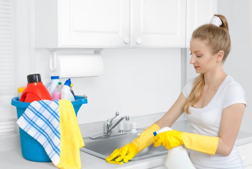 Technician wearing PPE during a carpet cleaning job in Putney